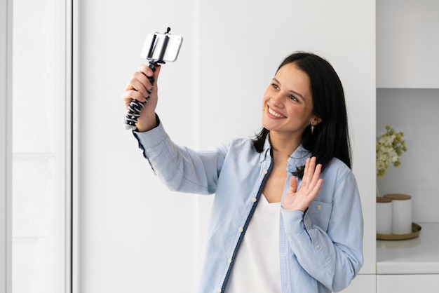 Woman taking a selfie with her phone