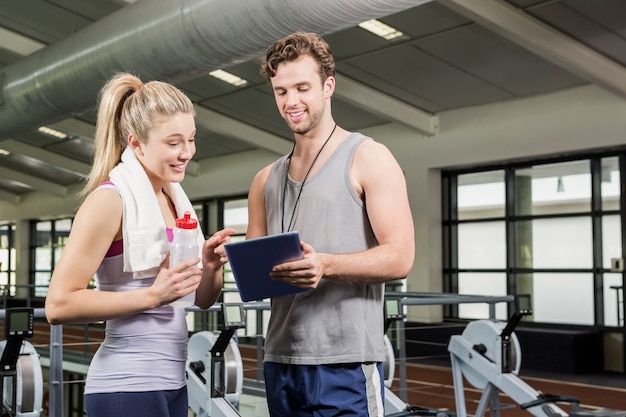 Woman talking to her trainer after a workout