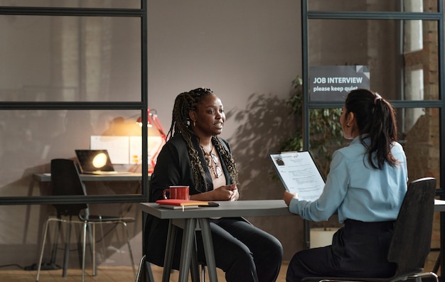 Woman talking to manager at job interview