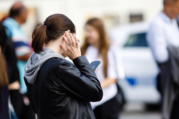 Woman talking on the phone on street