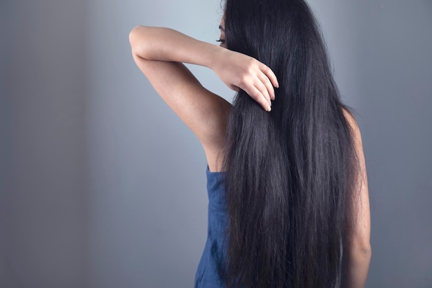 Woman touching in long hair