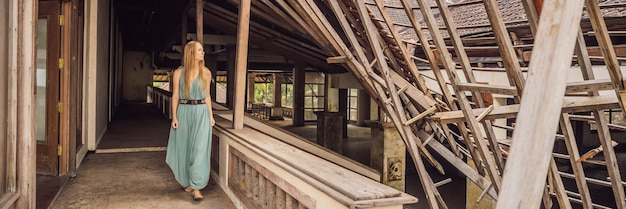 Woman tourist in abandoned and mysterious hotel in bedugul indonesia bali island bali travel concept