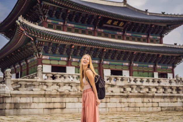 Woman tourist in korea Gyeongbokgung Palace grounds in Seoul South Korea Travel to Korea concept