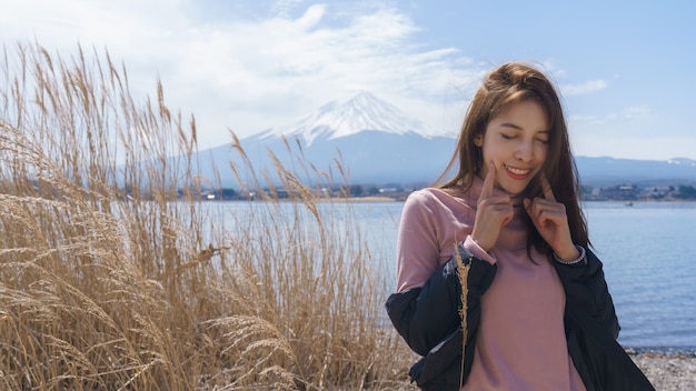 Woman tourist at Mt Fuji, lake kawaguchiko, Japan.