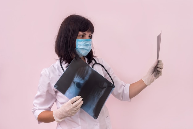 Woman traumatologist with x-ray of patient's foot