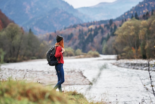 Woman travel tourism mountains landscape lake river autumn High quality photo