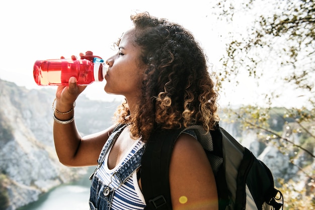 Woman traveler drinking water