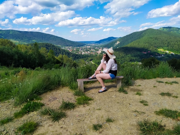 Woman traveler enjoying of relaxing with mountain view