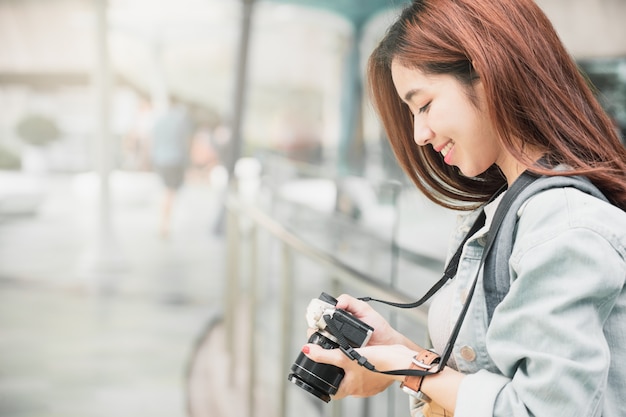 Woman Traveler with backpack traveling on her summer vacation.