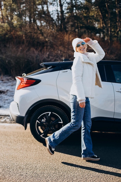 Woman travelling by car stopped by on the road