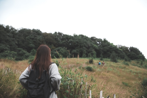 woman trekking in tropical forest