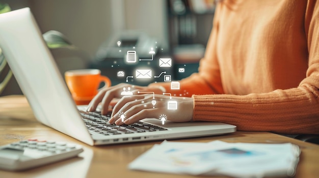 a woman typing on a laptop with a lot of icons on the screen