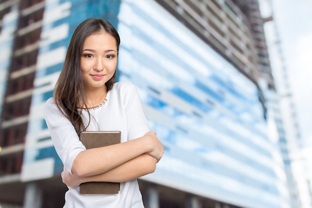 Woman university / college student holding book