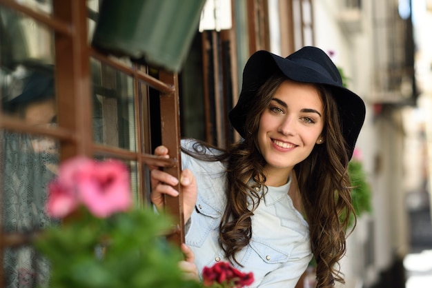 Woman in urban background wearing casual clothes