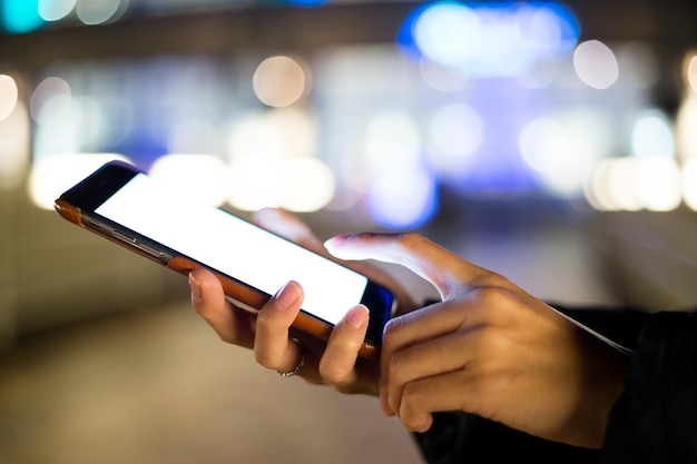 Woman use of cellphone at night