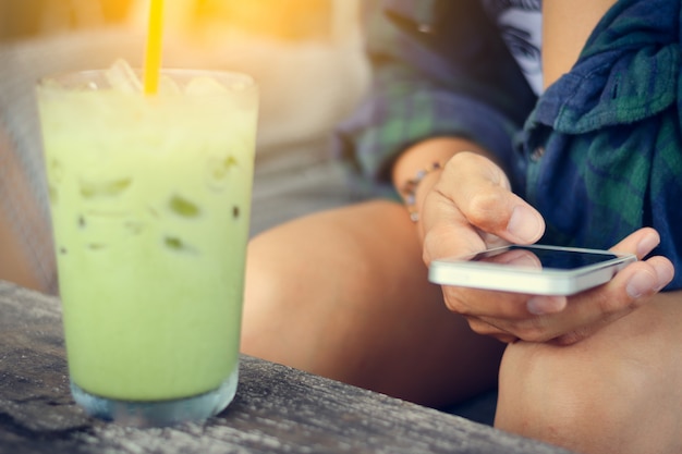 Woman use mobile phone in coffee shop