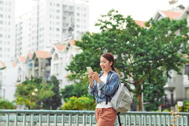 Woman use of mobile phone look for destination