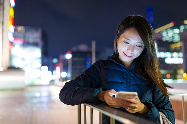 Woman use of mobile phone at outdoor