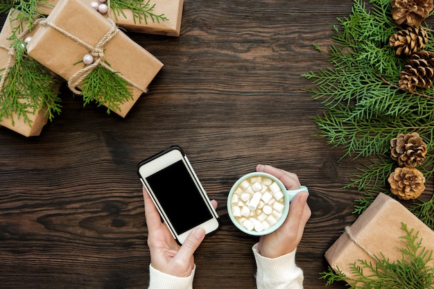 Woman use smartphone with copyspace on wood