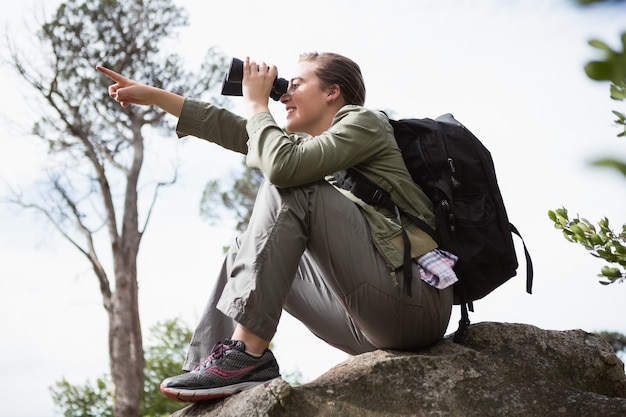 Woman using binoculars