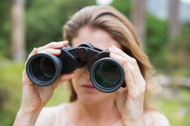 Woman using binoculars