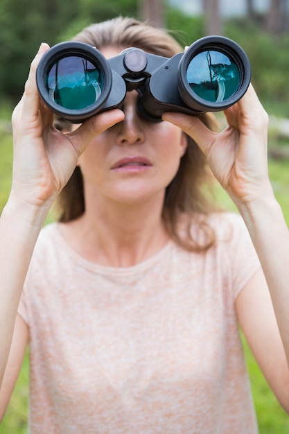 Woman using binoculars