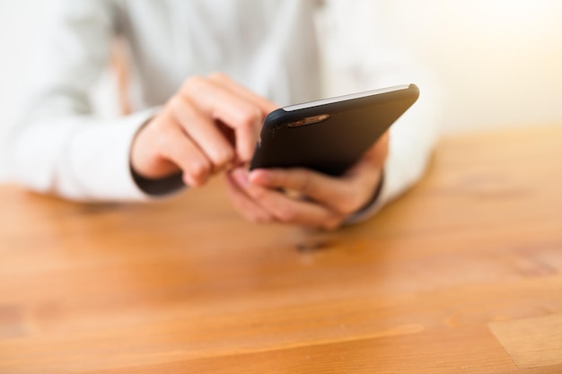 Woman using cellphone at indoor