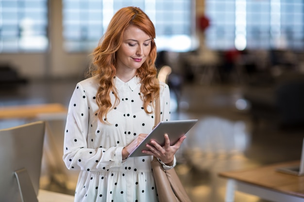 Woman using digital tablet