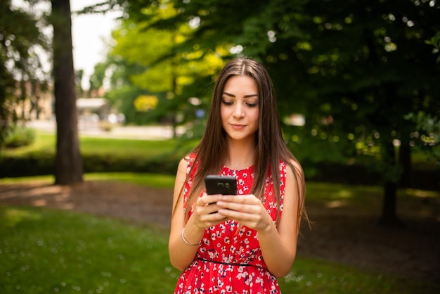 Woman using her cellphone in a park