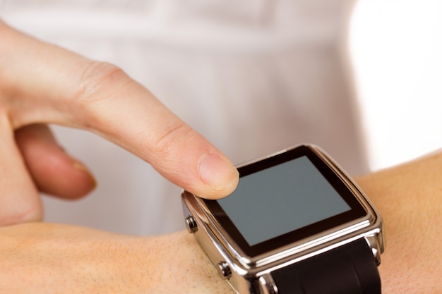 Woman using her smart watch