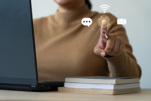 Woman using laptop connecting with global network for data and digital market