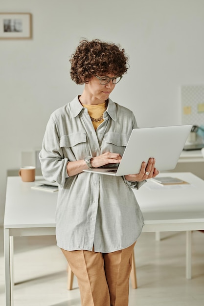 Woman using laptop at her work