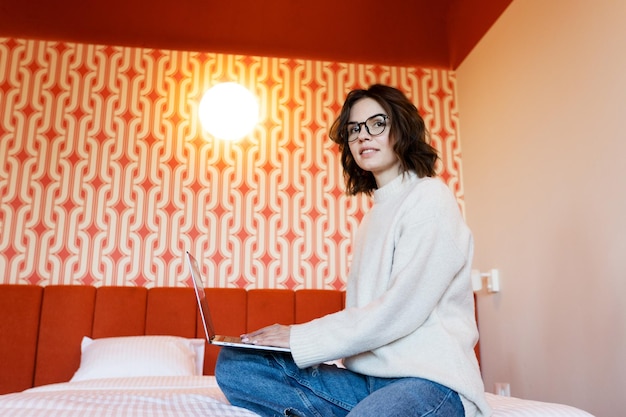 Woman using laptop at home