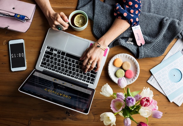 Woman Using Laptop Shopping Online