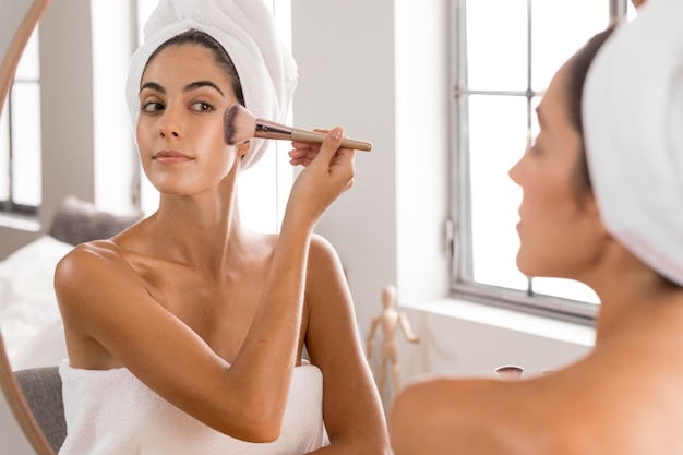 Woman using a make-up brush