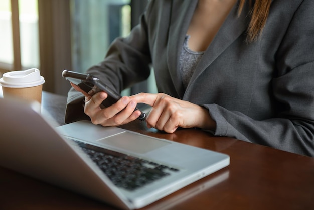 Woman using mobile phone tabletCloseup on blurred backgroundxA