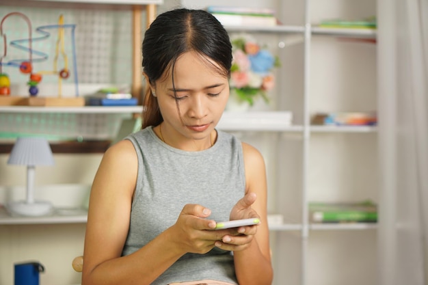 woman using phone to shop online