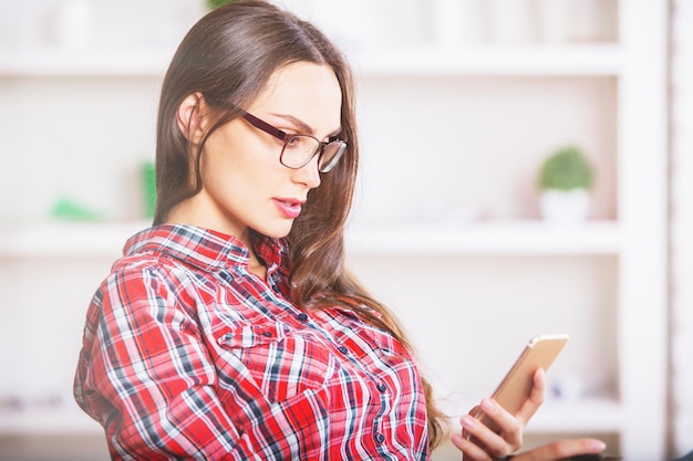 Woman using phone side