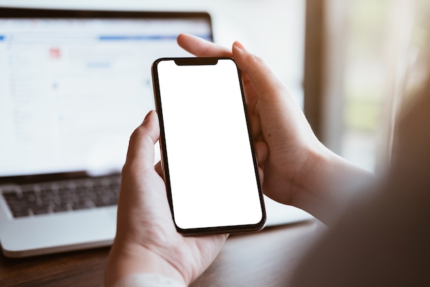 Woman using Smartphone. Blank screen mobile phone for graphic display montage.