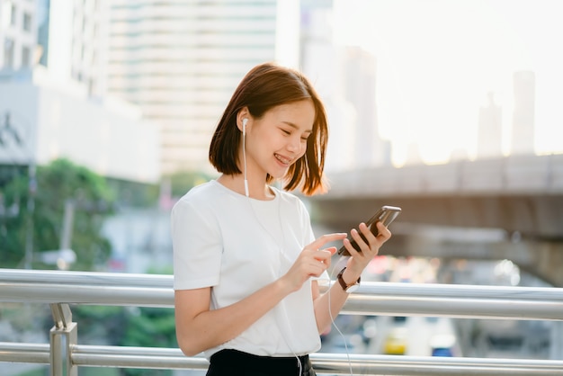 Woman using smartphone, During leisure time. 