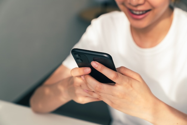 Woman using smartphone, During leisure time