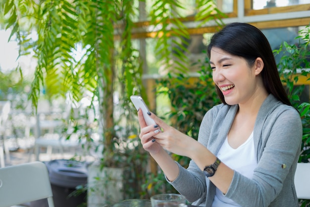 woman using smartphone shopping website online, shopping concept