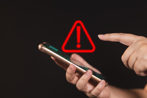 Photo woman using smartphone with notification error warning sign over on mobile phone maintenance connection application programmer developer security network dangerous