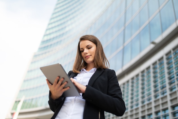 Woman using a tablet out of her office