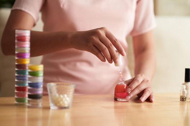 Woman using transparent nail polish