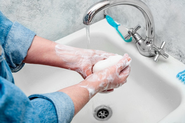 Woman Very Carefully Washing Hand with Soap During Epidemic Coronavirus.