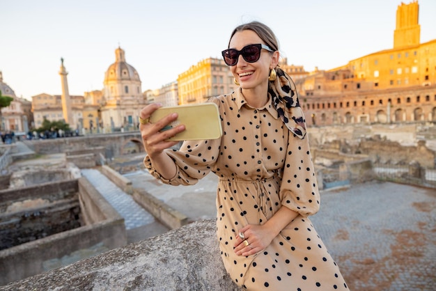 Woman visiting Roman forum while traveling Rome