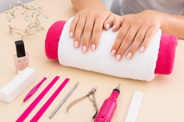 Woman waiting for her manicure to be done