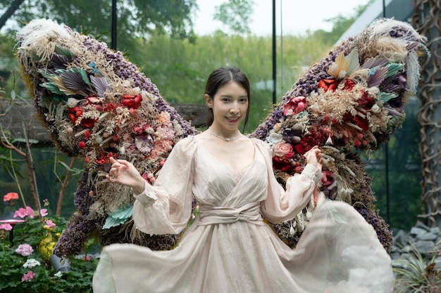 Woman walk in beautiful flower exhibition indoor