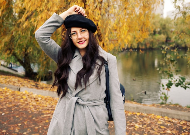 Woman walking in an autumn park